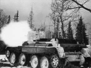 Soviet-finnish war, 1939-1940, a soviet red army tank firing, a still from the newsreel documentary film, 'mannerheim line'.