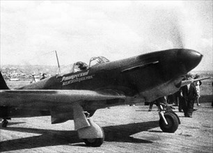 World war 2, soviet air force yakovlev yak-9 fighter on an airfield preparing for take-off.
