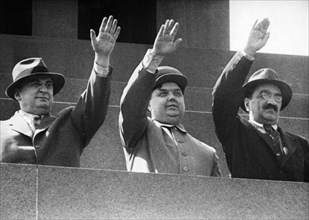 L, beria, g, malenkov, and a,mikoyan on the rostrum on lenin's tomb during a may day demonstration in red square, moscow, ussr, may 1, 1949.