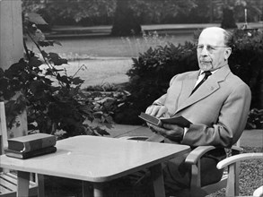 Walter ulbricht, state council chairman and first secretary of the central committee of the socialist unity party (sed), reading a book in the park of the residence of the state council, june 25, 1963...