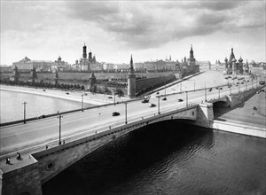 A view of the kremlin over the moscow river in the 1930s.