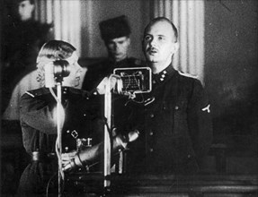 World war 2, december 15, 1943, still from a film on the kharkov trial produced by artkino, hans ritz pleads guilty, the woman is the court translator.