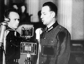 World war 2, december 15, 1943, still from a film on the kharkov trial produced by artkino, wilhelm langheld pleads guilty, langheld spoke in german which was translated by the man at his side.