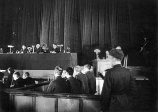 World war 2, december 15, 1943, still from a film on the kharkov trial produced by artkino, judges, prisoners docket, and guard.