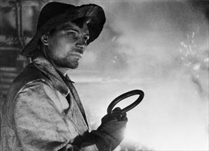 A steel worker of the kuznetsk iron and steel works, ussr, 1930s.