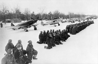 World war 2, members of a guards unit taking the guardsmen's oath on a snow covered airfield on the soviet/german front, soviet air force mikoyan-gurevich mig-3 (i-18) fighters in winter camouflage ar...