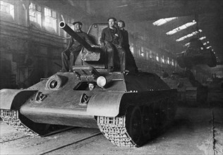 World war 2, finished t-34 tanks leaving the factory in the urals, 1944.