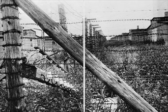 Lublin [majdanek] murder camp the electrified fence surrounding the barracks where lived the doomed victims awaiting their turn.