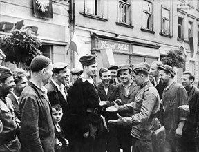 Residents of the polish city of rzeszow speaking with red army soldiers, late 1940s.