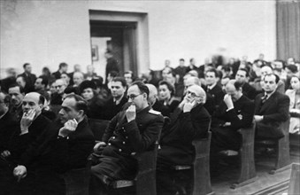 Soviet architects listening to the opening speeches at the opening of the 'prefabricated housing in the usa' exhibition at the moscow architects club, 1940s.