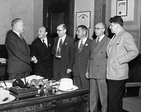 Mayor fletcher bowron of los angeles (left) meeting with professor solomon mikhoels and lt, colonel itzik feffer, officers of the jewish anti-fascist committee, during their fund-raising trip to the u...