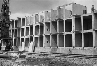 A block of flats being constructed in nowa huta in the krakow province in poland, september 1962, these buildings are being constructed using an experimental method called 'dominoes' from precast unit...