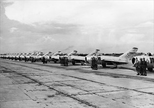 Polish air force, a group of pilots and polish-made lim-1 (mig-15 built under license) jet fighters prior to air exercises on liberation day, july 22, 1955.