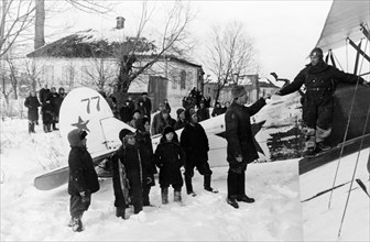 World war 2, a soviet polikarpov po-2 (u-2) plane in liberated byelgorod in february 1943, the people are giving the pilot letters to relatives to mail.