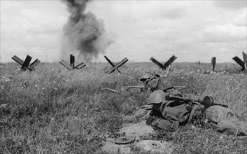 World war 2, august 1943, under cover of artillery fire, four soviet sappers disarm a section of german defenses, ukraine.