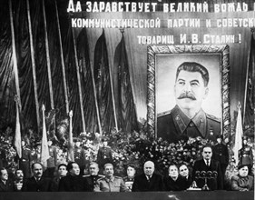 Ceremony at the bolshoi theater celebrating joseph stalin's 70th birthday, seated, from left to right, are  togliatti, budenni, kaganovich, suslov, mao tse-tung (zedong), bulganin, stalin, vassilevsky...