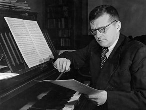 Soviet composer, dmitri shostakovich, working at his piano, 1950, he won the stalin prize for his oratorio 'song of the woods' and the music to the film 'the fall of berlin'.