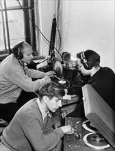 Laboratory assistants at the lvov state university receiving radio signals from sputnik 1, ussr, 1957.