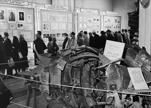 Moscow residents at an exhibition of evidence related to the trial of gary powers, american pilot of u2 spy plane, ussr, 1960, foreground: part of the lockheed u2 spy plane.
