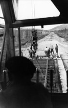 Workers laying track for the 400-mile abakan-taishet railroad through the sayan mountains in siberia, 1960.