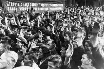 Show trials, workers of the dynamo factory voting for the condemnation of participants in the trotsky-zinoviev plot, 1936, the banner reads: 'wipe the trotsky-zinovievist band of murderers off the fac...