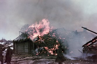 World war 2, farm house being burned by the germans in byelorussia.