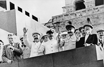 Maxim gorky, vyacheslav molotov, k, voroshilov, joseph stalin, ,mikhail kalinin and nikolai bulganin (left to right) on the platform of the lenin mausoleum during a sports parade in red square, moscow...