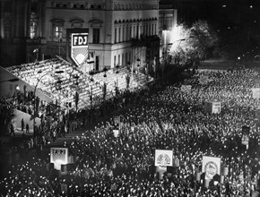A torchlight procession of free german youth organization members in honor of the 30th anniversary of the founding of the gdr on unter der linden avenue in berlin, october 10, 1979.