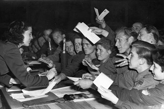 Parliament of free german youth in leipzig, may 29, 1952, raymonde dien, valiant french fighter for peace, giving her autograph to participants of the congress.