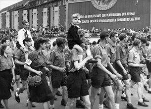 Free german youth marching before the reviewing stand during the parliament of free german youth in leipzig, june 1, 1952.