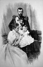 The royal couple of russia, tsar nicholas ll and tsarina alexandra fyodorovna with child.