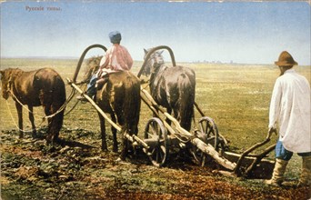 Russian peasants tilling a field in the late 19th century.