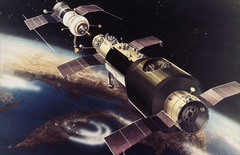 Artist's rendering of a soyuz space craft docking with the salyut 1 orbiting space station, launched in 1971, it was the first soviet space station.