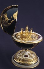 Faberge egg in the shape of a globe with a model of a ship inside (columbus'?).