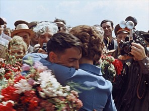 Soviet cosmonauts valentina tereshkova and valery bykovsky hug after bykovsky's flight in vostok 5, 1963.