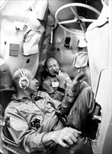 July 9, 1974, yuri gagarin spacemen's training centre, alexei leonov, commander of the first soyuz crew (right), thomas stafford, commander of the apollo flight crew, training in a mock-up soyuz space...