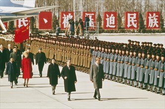 American president richard m, nixon reviewing the honor guard at beijing airport upon his arrival for his meeting with chou en-lai, china, 1972.