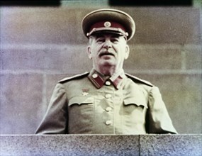 Joseph stalin watching the may day parade from lenin's tomb in red square, moscow, ussr, 1952, (still from a news reel).