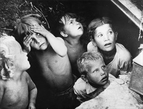 Soviet children in an air raid shelter during a nazi air raid, world war 2, ussr.