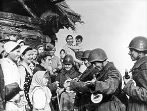 The population of a byelorussian village meeting the soviet red army liberators during world war 2.