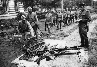 Operation august storm (battle of manchuria), japanese soldiers who defended harbin from red army surrender their weapons, harbin, manchuria, soviet officer (right) takes inventory, august 20th, 1945,...
