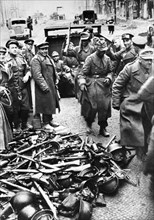 German soldiers surrendering their weapons to soviet red army troops in berlin, germany, 1945.