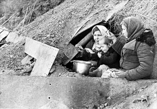 Residents of stalingrad who had chosen not to leave the besieged city, take a shelter in a dugout, in october 1942.