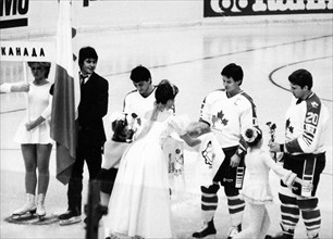 Traditional 'bread and salt' of hospitality being presented to the canadian ice hockey team during the opening ceremonies of the izvestia prize international ice hockey tournament on december 16, 1986...