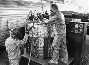 Technicians in protective suits operating a mobile chemical agents destruction unit at soviet military base of shikhany, saratov region, ussr, october 4th 1987, diplomats and military experts from 45 ...