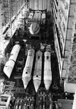 The rocket-carrier 'energia' in the assembly and fuelling shop of the baikonur cosmodrome during the final preparations for the launch of the multi-purpose space transportation system, november 1988.