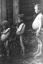 Famine, soviet union, 1922, three starving orphans aged 5,7, and 12 in a village on the volga.