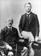 Pyotr tchaikovsky, the famous russian composer (seated) with his nephew v, davydov.