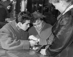 Mikhail borulin and natasha zaitseva choosing a present at the jeweller's, june 1957.