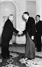 Us ambassador llewellyn thompson shaking hands with k,e, voroshilov, president of the presidium of the ussr supreme soviet, after presenting his credentials, moscow, july 1957.